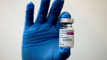 FILE PHOTO: A medical worker holds a bottle of AstraZeneca's COVID-19 vaccine at a vaccination centre in Kuala Lumpur, Malaysia May 5, 2021 in this file photo. REUTERS/Lim Huey Teng/File Photo/File Photo