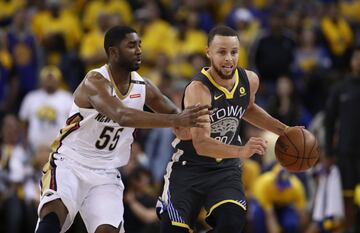 Stephen Curry y E'Twaun Moore.