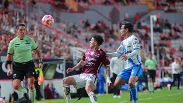 Pavel Perez (L) of Necaxa fights for the ball with Fernando Monarrez (R) of Puebla during the 9th round match between Necaxa and Puebla as part of the Liga BBVA MX, Torneo Apertura 2025 at Victoria Stadium, on September 19, 2025 in Aguascalientes, Mexico.
