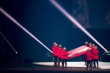 Members of the Royal Canadian Mounted Police carry in the Canadian flag during the opening ceremonies at the 2015 Pan American Games in Toronto, Ontario on July 10,  2015.  AFP PHOTO/GEOFF ROBINS