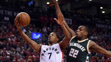 Apr 18, 2017; Toronto, Ontario, CAN; Toronto Raptors guard Kyle Lowry (7) shoots for a basket as Milwaukee Bucks forward Khris Middleton (22) defends in the second half in game two of the first round of the 2017 NBA Playoffs at Air Canada Centre. Mandatory Credit: Dan Hamilton-USA TODAY Sports