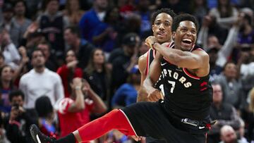 Mar 7, 2018; Detroit, MI, USA; Toronto Raptors guard Kyle Lowry (7) celebrates a bases by guard DeMar DeRozan (back) in the second half against the Detroit Pistons at Little Caesars Arena. Mandatory Credit: Rick Osentoski-USA TODAY Sports