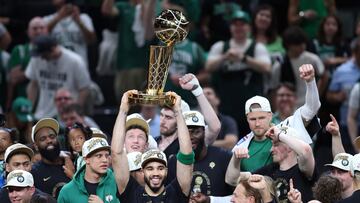 BOSTON, MASSACHUSETTS - JUNE 17: Jayson Tatum #0 of the Boston Celtics lifts the Larry O�Brien Championship Trophy after Boston's 106-88 win against the Dallas Mavericks in Game Five of the 2024 NBA Finals at TD Garden on June 17, 2024 in Boston, Massachusetts. NOTE TO USER: User expressly acknowledges and agrees that, by downloading and or using this photograph, User is consenting to the terms and conditions of the Getty Images License Agreement.   Adam Glanzman/Getty Images/AFP (Photo by Adam Glanzman / GETTY IMAGES NORTH AMERICA / Getty Images via AFP)