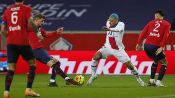 PSG's Kylian Mbappe, center, in action during the French League One soccer match between Lille and Paris Saint-Germain at the Stade Pierre Mauroy stadium in Villeneuve d'Ascq, northern France Sunday, Dec. 20, 2020. (AP Photo/Michel Spingler)