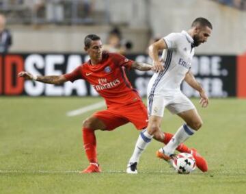 Di María (left) challenges Real's Dani Carvajal.