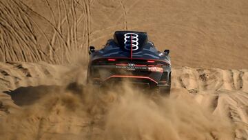 Audi&#039;s electric Spanish driver Carlos Sainz of Spain and co-driver Lucas Cruz of Spain compete during the Stage 1A of the Dakar Rally 2022 between Jeddah and Hail, in Saudi Arabia, on January 1, 2022. (Photo by FRANCK FIFE / AFP)