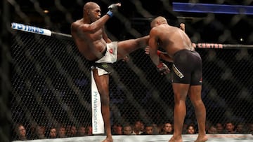 Jon Jones knocks out Daniel Cormier during their UFC 214 bout.