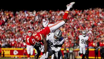 Dec 12, 2021; Kansas City, Missouri, USA; Kansas City Chiefs wide receiver Byron Pringle (13) is upended by Las Vegas Raiders safety Johnathan Abram (24) as cornerback Casey Hayward (29) defends during the first half at GEHA Field at Arrowhead Stadium. Ma