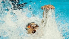 Swimmer Michael Phelps poses with all 28 Olympic medals