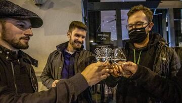 PRAGUE, CZECH REPUBLIC - OCTOBER 10: Customers drink outside a bar shortly after closing time on October 10, 2020 in Prague, Czech Republic. After relaxing almost all restrictive measures in the summer, the Czech government has responded to one of the worst spikes in European countries by declaring a state of emergency earlier this week. That has been accompanied by restrictions ranging from limiting public events to closing restaurants and pubs at 8 pm. (Photo by Gabriel Kuchta/Getty Images)