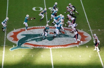 MIAMI GARDENS, FLORIDA - DECEMBER 20: Tua Tagovailoa #1 of the Miami Dolphins receives the snap against the New England Patriots during the fourth quarter in the game at Hard Rock Stadium on December 20, 2020 in Miami Gardens, Florida.