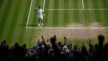 Spain's Carlos Alcaraz reacts to winning the second set against Serbia's Novak Djokovic during their men's singles final tennis match on the last day of the 2023 Wimbledon Championships at The All England Tennis Club in Wimbledon, southwest London, on July 16, 2023. (Photo by SEBASTIEN BOZON / AFP) / RESTRICTED TO EDITORIAL USE