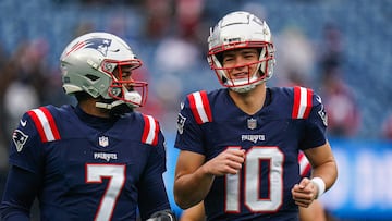 Dec 28, 2024; Foxborough, Massachusetts, USA; New England Patriots quarterback Drake Maye (10) and quarterback Jacoby Brissett (7) warm up before the start of the game against the Los Angeles Chargers at Gillette Stadium. Mandatory Credit: David Butler II-Imagn Images