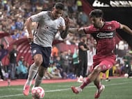Cruz Azul's Uruguayan forward #21 Gabriel Fernandez and Tijuana's defender #06 Jesus Gomez fight for the ball during the Liga MX Apertura tournament football match between Tijuana and Cruz Azul at the Caliente Stadium in Tijuana, Baja California, Mexico on September 28, 2025. (Photo by Guillermo Arias / AFP)
