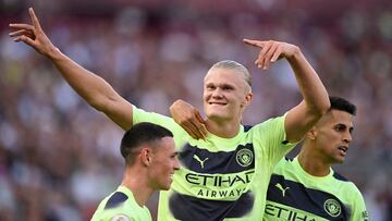 Soccer Football - Premier League - West Ham United v Manchester City - London Stadium, London, Britain - August 7, 2022 Manchester City's Erling Braut Haaland celebrates scoring their second goal with Phil Foden and Joao Cancelo REUTERS/Tony Obrien EDITORIAL USE ONLY. No use with unauthorized audio, video, data, fixture lists, club/league logos or 'live' services. Online in-match use limited to 75 images, no video emulation. No use in betting, games or single club /league/player publications. Please contact your account representative for further details. TPX IMAGES OF THE DAY