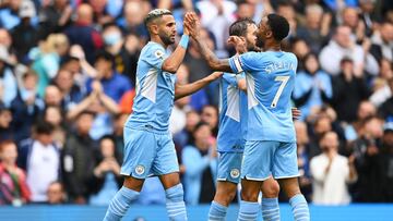 MANCHESTER, ENGLAND - AUGUST 21: Riyad Mahrez of Manchester City celebrates with Raheem Sterling after scoring their side's fifth goal during the Premier League match between Manchester City and Norwich City at Etihad Stadium on August 21, 2021 in Ma
