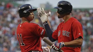 Boston Red Sox&#039;s Rafael Devers, left, celebrates his solo home run with Xander Bogaerts during the first inning of the team&#039;s baseball game against the Los Angeles Dodgers at Fenway Park, Friday, July 12, 2019, in Boston. (AP Photo/Elise Amendol