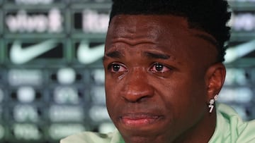 Brazil's forward Vinicius Junior cries as he gives a press conference on the eve of the international friendly football match between Spain and Brazil at the Ciudad Real Madrid training ground in Valdebebas, outskirts of Madrid, on March 25, 2024. Spain arranged a friendly against Brazil at the Santiago Bernabeu under the slogan "One Skin" to help combat racism. (Photo by Pierre-Philippe MARCOU / AFP)