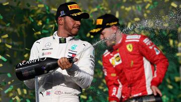 MELBOURNE, AUSTRALIA - MARCH 25: Second placed Lewis Hamilton of Great Britain and Mercedes GP celebrates on the podium during the Australian Formula One Grand Prix at Albert Park on March 25, 2018 in Melbourne, Australia. (Photo by Charles Coates/Getty Images)