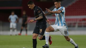 Argentina's Independiente Chilean Pedro Hernandez (L) and Argentina's Atletico Tucuman Yonathan Cabral vie for the ball during their closed-door Copa Sudamericana second round football match at the Libertadores de America Stadium in Buenos Aires, on October 29, 2020, amid the COVID-19 novel coronavirus pandemic. (Photo by Daniel JAYO / POOL / AFP)
