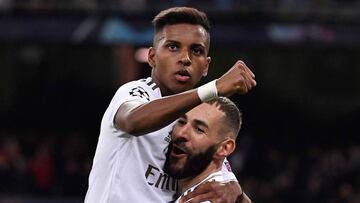 Real Madrid&#039;s French forward Karim Benzema (R) celebrates with Real Madrid&#039;s Brazilian forward Rodrygo after scoring during the UEFA Champions League Group A football match between Real Madrid and Galatasaray at the Santiago Bernabeu stadium in 