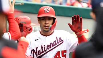 WASHINGTON, DC - OCTOBER 01: Joey Meneses #45 of the Washington Nationals celebrates scoring a run on a Luis Garcia #2 single in the seventh inning during game one of a doubleheader baseball game against the Philadelphia Phillies at Nationals Park on October 1, 2022 in Washington, DC.   Mitchell Layton/Getty Images/AFP