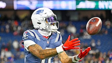 Nov 13, 2025; Foxborough, Massachusetts, USA; New England Patriots cornerback Christian Gonzalez (0) makes a catch during the first half against the New York Jets at Gillette Stadium. Mandatory Credit: Eric Canha-Imagn Images