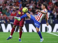 Barcelona's Portuguese defender #02 Joao Cancelo and Atletico Madrid's Spanish midfielder #06 Koke fight for the ball during the Spanish league football match between Club Atletico de Madrid and FC Barcelona at Metropolitano Stadium in Madrid on April 4, 2026. (Photo by Pierre-Philippe MARCOU / AFP)