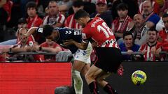 Real Betis' Spanish midfielder Ayoze Perez (L) fights for the ball with Athletic Bilbao's Spanish defender Oscar De Marcos during the Spanish league football match between Athletic Club Bilbao and Real Betis at the San Mames stadium in Bilbao on May 4, 2023. (Photo by ANDER GILLENEA / AFP)