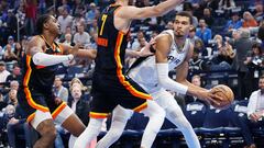 Oklahoma City Thunder forward Chet Holmgren (7) defends a pass by San Antonio Spurs center Victor Wembanyama (1) during the first quarter at Paycom Center.
