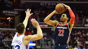 Feb 25, 2018; Washington, DC, USA; Washington Wizards forward Otto Porter Jr. (22) shoots over Philadelphia 76ers guard T.J. McConnell (12) during the first half at Capital One Arena. Mandatory Credit: Brad Mills-USA TODAY Sports