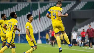 Nassr&#039;s forward Abderrazak Hamdallah (R) celebrates his goal during the AFC Champions League Round of 16 match between Saudi&#039;s Al-Nassr and Saudi&#039;s Al-Taawoun on September 27, 2020, at the Education Stadium in the Qatari city of Ar-Rayyan. 