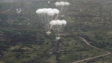 FILE PHOTO: A view from a transport military plane shows Russian airborne combat vehicles descending beneath parachutes during the exercises "Zapad-2021" staged by the armed forces of Russia and Belarus in Kaliningrad Region, Russia, September 13, 2021. REUTERS/Vitaly Nevar/File Photo