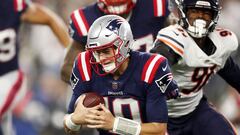 FOXBOROUGH, MASSACHUSETTS - OCTOBER 24: Mac Jones #10 of the New England Patriots runs with the ball during the first quarter against the Chicago Bears at Gillette Stadium on October 24, 2022 in Foxborough, Massachusetts.   Adam Glanzman/Getty Images/AFP