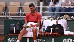 Serbia's Novak Djokovic sits between games during his men's singles round of sixteen match against Argentina's Francisco Cerundolo on Court Philippe-Chatrier on day nine of the French Open tennis tournament at the Roland Garros Complex in Paris on June 3, 2024. (Photo by Emmanuel Dunand / AFP)
