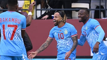 Democratic Republic Of Congo's forward #10 Theo Bongonda celebrates his goal teammates during the Africa Cup of Nations (CAN) Group D football match between Democratic Republic of Congo and Benin at Al Medina Stadium in Rabat on December 23, 2025. (Photo by SEBASTIEN BOZON / AFP)
