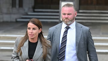 LONDON, ENGLAND - MAY 16: Coleen Rooney and Wayne Rooney depart the Royal Courts of Justice, Strand on May 16, 2022 in London, England. Coleen Rooney, wife of Derby County manager Wayne Rooney, and Rebekah Vardy, wife of Leicester City striker Jamie Vardy, are locked in a libel battle dubbed by the media as the "Wagatha Christie" trial. The case centres around accusations that Mrs Vardy leaked false stories about Mrs Rooney's private life to the press. (Photo by Karwai Tang/WireImage)