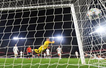 SEVILLE, SPAIN - OCTOBER 15: Jordan Pickford of England divces for the ball during the UEFA Nations League A Group Four match between Spain and England at Estadio Benito Villamarin on October 15, 2018 in Seville, Spain.