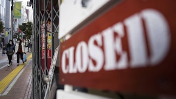 TOKYO, JAPAN - APRIL 08: Women walk near a closed sign outside a restaurant on April 08, 2020 in Tokyo, Japan. Japan's Prime Minister Shinzo Abe yesterday declared a state of emergency that will cover 7 of Japans 47 prefectures, including Tokyo and O