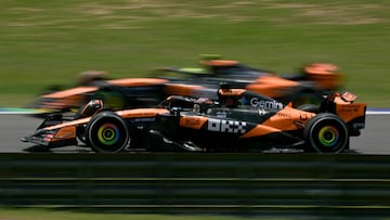 McLaren's Australian driver Oscar Piastri drives next to his teammate British driver Lando Norris during the practice session of the Sao Paulo Formula One Grand Prix at the Jose Carlos Pace racetrack, aka Interlagos, in Sao Paulo, Brazil on November 7, 2025. (Photo by Nelson ALMEIDA / AFP)