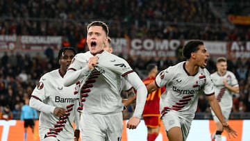 Bayer Leverkusen's German midfielder #10 Florian Wirtz celebrates with teammates after scoring his team first goal during the UEFA Europa League semi final first leg football match between AS Roma and Bayern Leverkusen at the Olympic stadium on May 2, 2024 in Rome. (Photo by Alberto PIZZOLI / AFP)