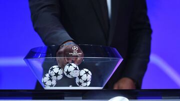 This handout picture taken and released by UEFA on October 1, 2020, shows a draw guest picking a ball during the UEFA Champions League group stage draw at the RTS studios in Geneva. (Photo by Harold Cunningham / UEFA / AFP) / RESTRICTED TO EDITORIAL USE -