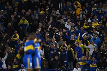 Fans of Boca Juniors celebrate their team's second goal during the Copa Libertadores group stage football match between Boca Juniors and Deportivo Pereira at La Bombonera stadium in Buenos Aires on April 18, 2023. (Photo by Luis ROBAYO / AFP)