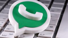 A 3D-printed Whatsapp logo is placed on the keyboard in this illustration.