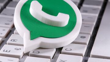 A 3D-printed Whatsapp logo is placed on the keyboard in this illustration.
