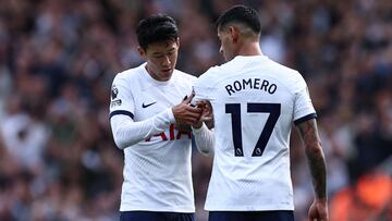 Tottenham Hotspur's South Korean striker #07 Son Heung-Min (L) gives the captain's armband to Tottenham Hotspur's Argentinian defender #17 Cristian Romero (R) as he leaves the game during the English Premier League football match between Arsenal and Tottenham Hotspur at the Emirates Stadium in London on September 24, 2023. (Photo by HENRY NICHOLLS / AFP) / RESTRICTED TO EDITORIAL USE. No use with unauthorized audio, video, data, fixture lists, club/league logos or 'live' services. Online in-match use limited to 120 images. An additional 40 images may be used in extra time. No video emulation. Social media in-match use limited to 120 images. An additional 40 images may be used in extra time. No use in betting publications, games or single club/league/player publications. / 