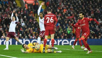 Liverpool&#039;s Egyptian midfielder Mohamed Salah (R) attempts a shot during the English Premier League football match between Liverpool and Aston Villa at Anfield in Liverpool, north west England on December 11, 2021. (Photo by Oli SCARFF / AFP) / RESTR