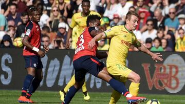 Thiago Mendes y Valentin Rongier.