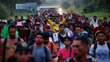 Migrants walk in a caravan along a highway on their way to the U.S. border, in Villa Comaltitlan, Mexico November 7, 2024. REUTERS/Daniel Becerril