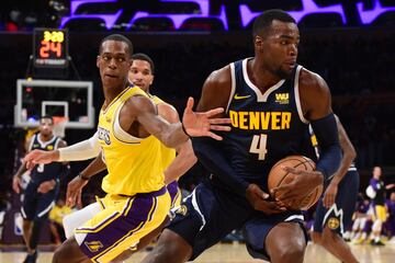 Paul Millsap y Rajon Rondo. 